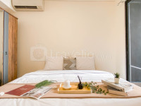 Basic 1BR with Extra Room at Meikarta Apartment By Travelio