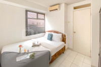 Comfortable with Wardrobe Room 1BR Kalibata City Apartment By Travelio