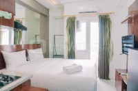 Simple and Cozy Stay Studio Room Green Pramuka City Apartment By Travelio