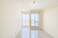 Cozy Studio Unfurnished at 33rd Floor Tifolia Apartment By Travelio