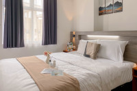 Minimalist 1BR Apartment at Vittoria Residence By Travelio