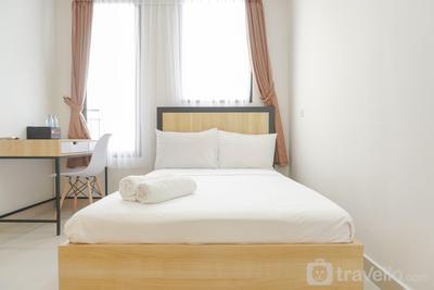 Minimalist and Homey Studio at Evenciio Margonda Apartment By Travelio