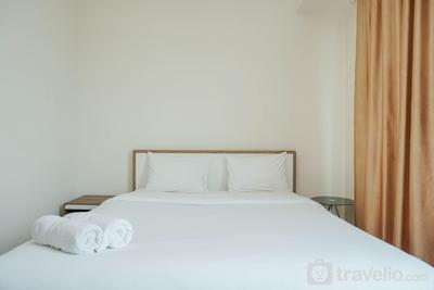 Modern and Comfy 1BR Puri Orchard Apartment By Travelio