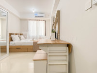 Modern Minimalist with Wooden Touch Studio at Apartment Meikarta By Travelio