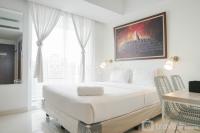 Minimalist Studio Room with City View at West Vista Apartment By Travelio