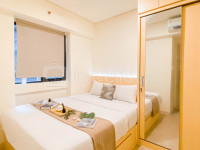 Modern Contemporary 2BR Apartment at Meikarta By Travelio