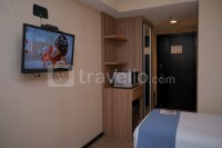 Apartemen Great Western - Warm and Minimalist Studio (No Kitchen) at Great Western Apartment By Travelio