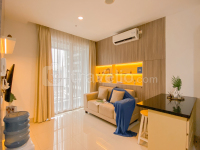 Spacious and Warm 2BR at Ciputra World 2 Apartment By Travelio