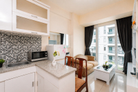 Comfortable and Homey 1BR at Apartment Tree Park City BSD By Travelio