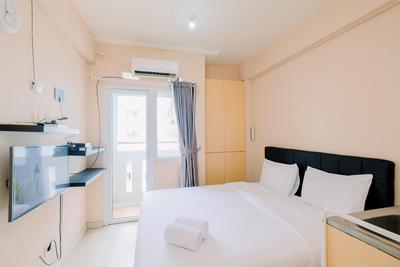 Best Homey and Cozy Studio (No kitchen) at Green Pramuka City Apartment By Travelio