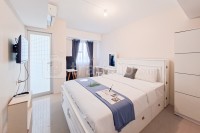 Minimalist Studio Room at Urbantown Serpong Apartment By Travelio