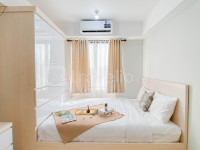 Warm Neutral Studio Room at Meikarta Apartment By Travelio