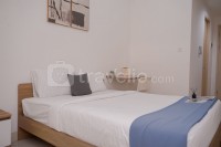 Modern and Homey Studio Apartment Tree Park City BSD By Travelio