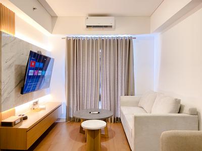 Spacious and Homey 2BR with Work Space at Meikarta Apartment By Travelio