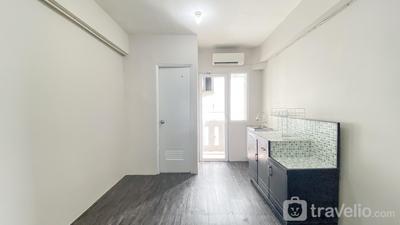 Simply Studio Unfurnished with AC at Green Pramuka City Apartment By Travelio