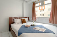 Simple 2BR Apartment near LRT Station at Gading Nias Residence By Travelio