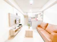 Minimalist and Cozy Living 2BR Meikarta Apartment By Travelio