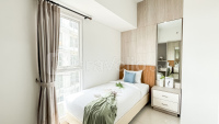 Brown Accent 2BR at Apartment Casa de Parco By Travelio