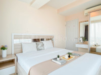 Simple and Homey 2BR at Grand Kamala Lagoon Apartment By Travelio