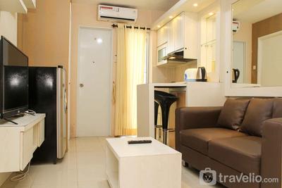 Minimalist and Warm 2BR Bassura City Apartment By Travelio