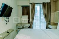Homey and Warm Studio Room at Tifolia Apartment By Travelio