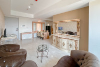 3BR with Private Lift Connected to Mall Grand Sungkono Lagoon Apartment By Travelio