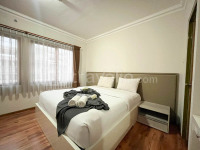 Spacious White 3BR at Grand Setiabudi Apartment By Travelio