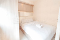 Modern Cozy 2BR at Puncak Permai Apartment By Travelio