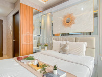 Modern Minimalist Studio at Transpark Cibubur Apartment By Travelio
