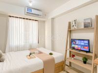 Modern Minimalist with Wooden Touch Studio at Apartment Meikarta By Travelio