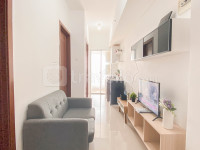 Basic Style and Compact 2BR Apartment at Vittoria Residence By Travelio