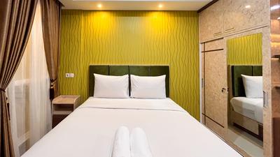 Modern Studio Room Apartment at Tamansari Skylounge Makassar By Travelio