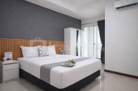 Restful 2BR with Sea View at Apartment Green Bay Condominium By Travelio