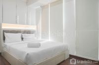 Fancy and Homey 1BR at Puri Orchard Apartment By Travelio