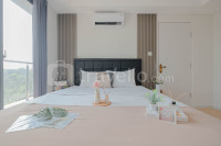 Spacious 3BR at Daan Mogot City Apartment By Travelio