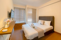 Homey and Good Place Studio at Tifolia Apartment By Travelio