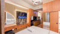 Comfortable Nice Wooden Touch Studio Apartment at Delft Ciputra Makassar By Travelio