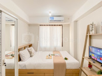 Modern Minimalist with Wooden Touch Studio at Apartment Meikarta By Travelio