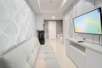 Grey Toned 1BR Apartment Tamansari Skylounge Makassar By Travelio