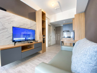 Homey and Spacious Studio Vasanta Innopark Apartment By Travelio