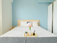 Cozy with Blue Accent 2BR at Podomoro Golf View Apartment By Travelio