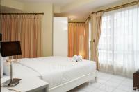 Comfy and Minimalist 2BR Apartment at 18 Residence Taman Rasuna By Travelio