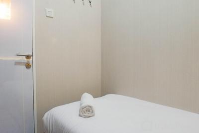 Apartemen Puncak Dharmahusada - Relaxing and Serene 2BR Apartment at Puncak Dharmahusada By Travelio