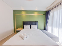 Homey and Minimalist Studio at Patraland Amarta Apartment By Travelio