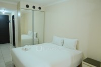 Minimalist Studio Room at Grand Serpong Apartment By Travelio
