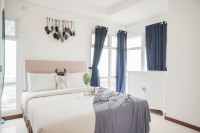 Spacious and Comfortable 2BR at Green Bay Condominium Apartment By Travelio
