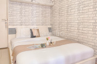 Cozy Living Studio above Mall with Pool View at Bassura city Apartment By Travelio