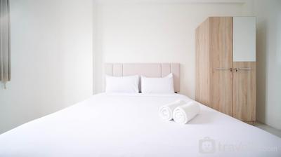 Best Deal 2BR at Puncak Dharmahusada Apartment By Travelio