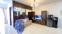 Nice and Warm 1BR at 18 Residence Rasuna Apartment By Travelio