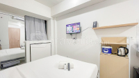 White Studio Room (No Kitchen) at Bandaraya - Tallasa City Makassar Apartment By Travelio